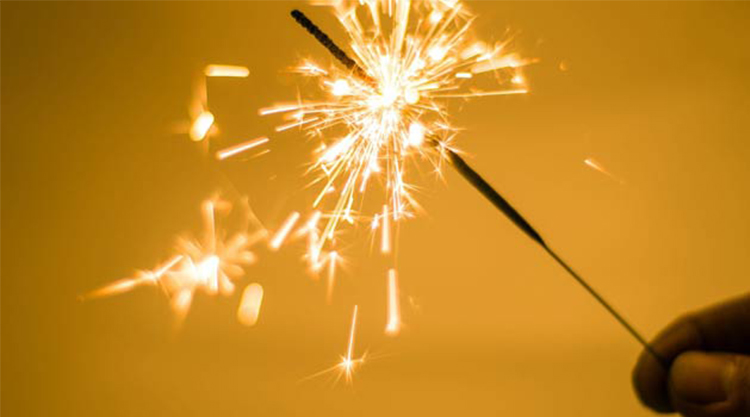 sparkler with yellow background