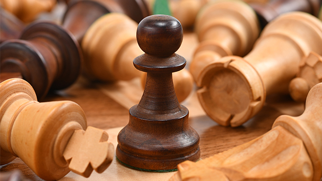 chess board with pieces knocked over